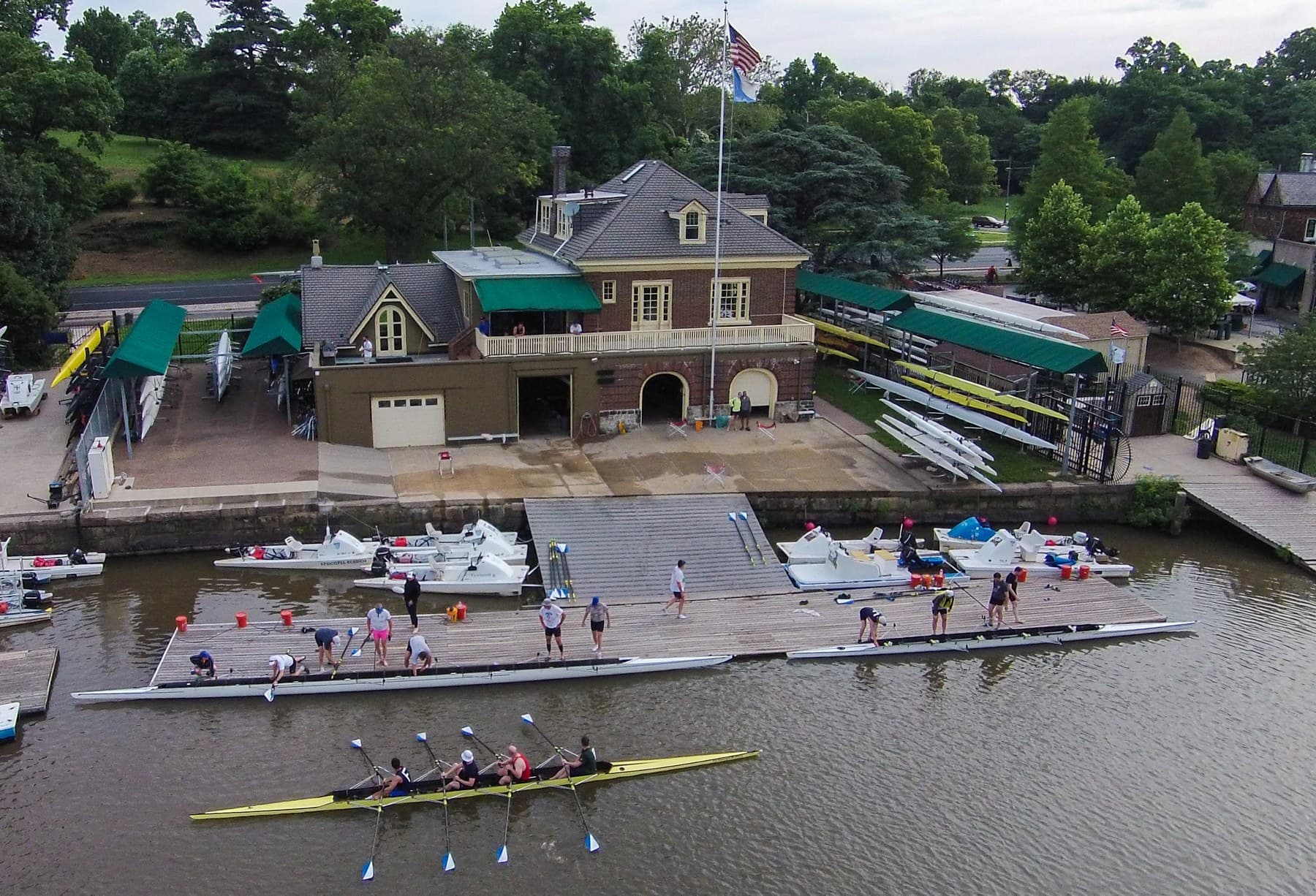 The Fairmount boathouse from above, with crews launching from the dock