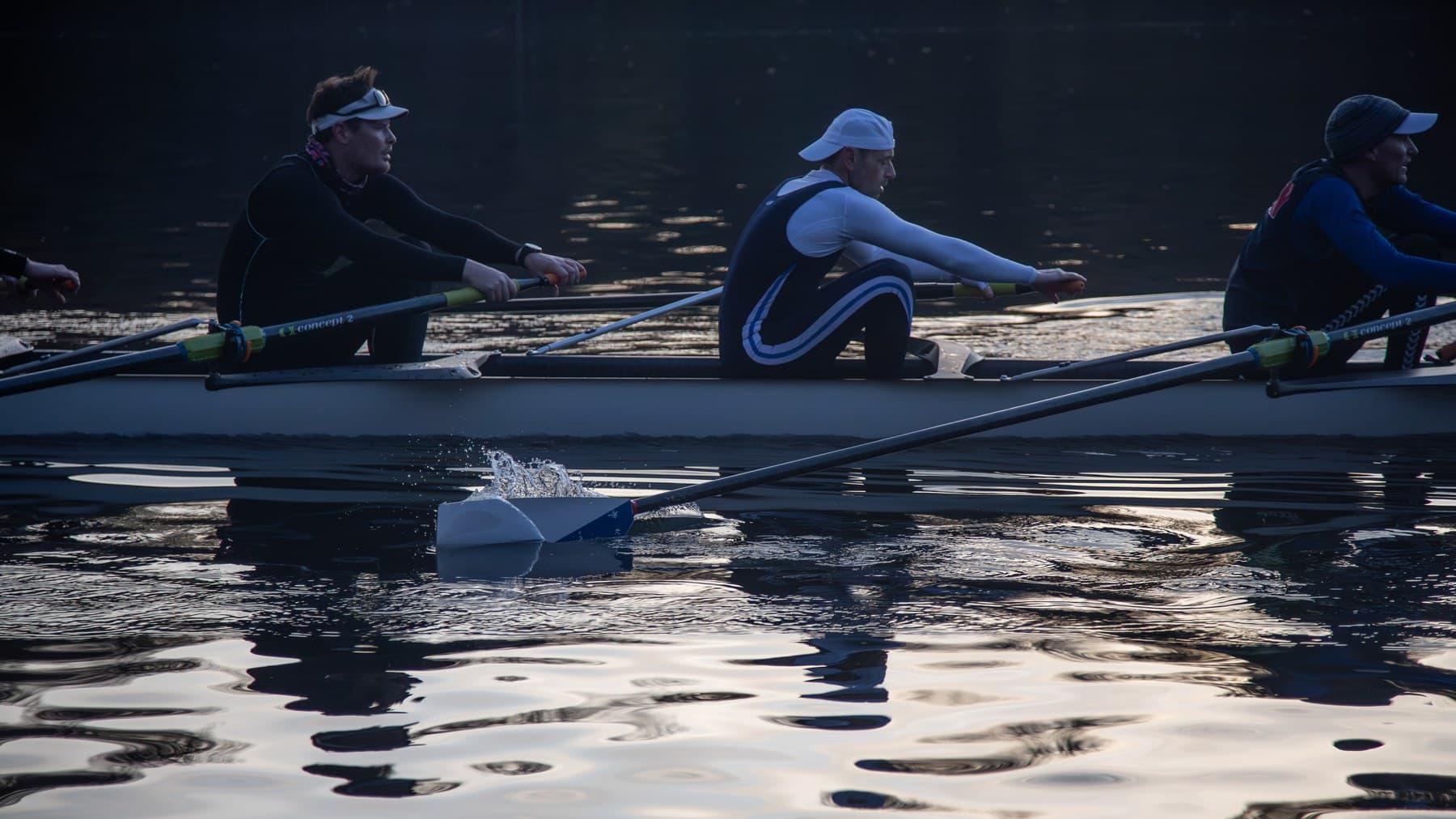 Fairmount rowers at the catch, blades in the water